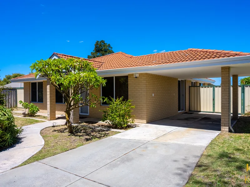 Inviting home with large bedrooms; some wooden floors and desirable side access