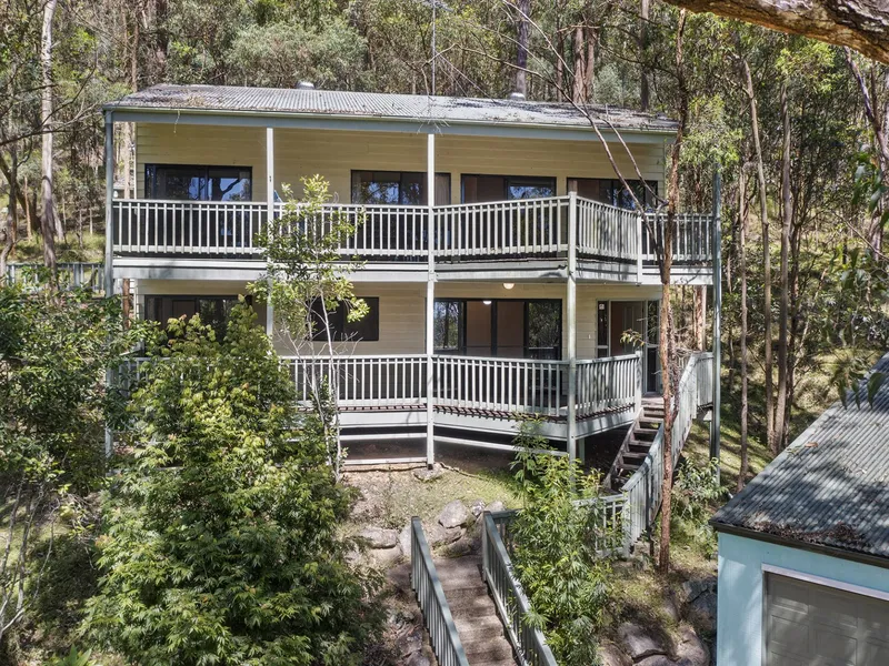 Architecturally designed split-level 4 bedroom home in quiet bushland setting