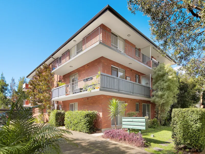 Sunny top floor gem with lush views