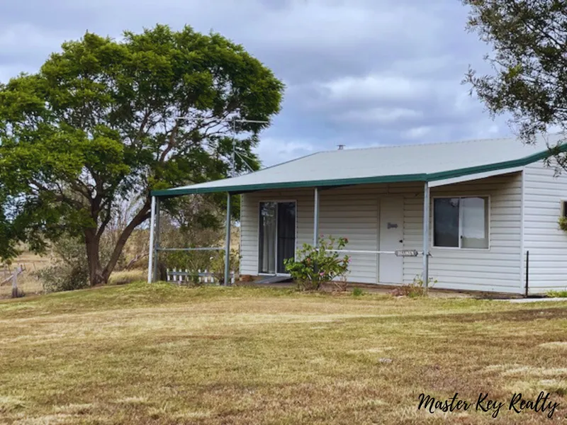 Country cottage with outstanding potential!