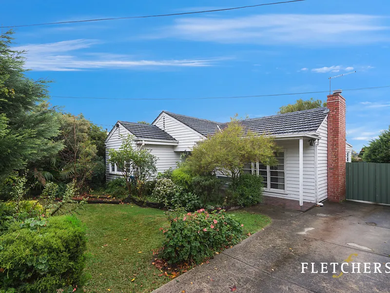 UPDATED FRIENDLY NEIGHBOURHOOD HOME WITH NORTH FACING REAR YARD
