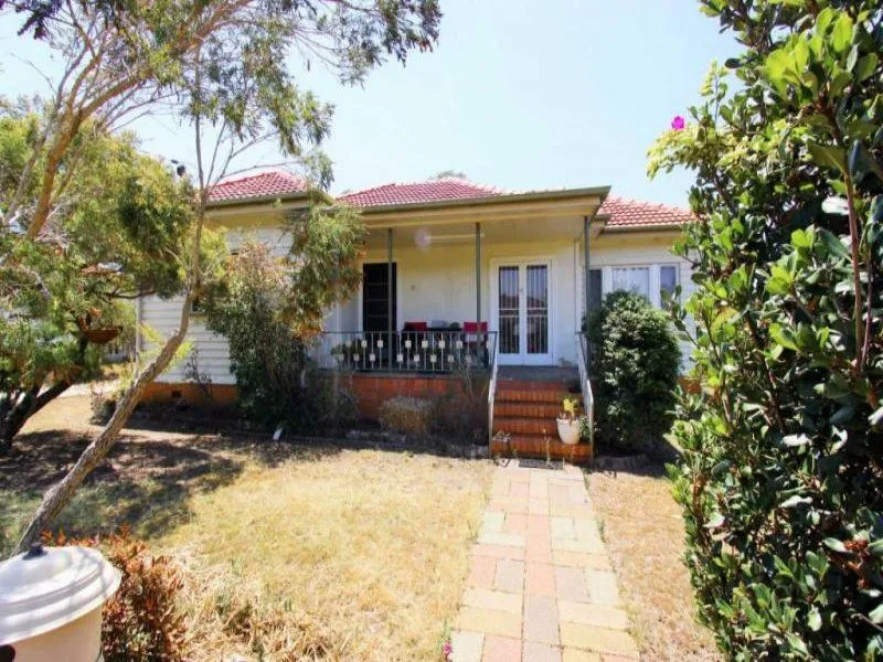 Check out those floors! Stunning post war home in One Mile 