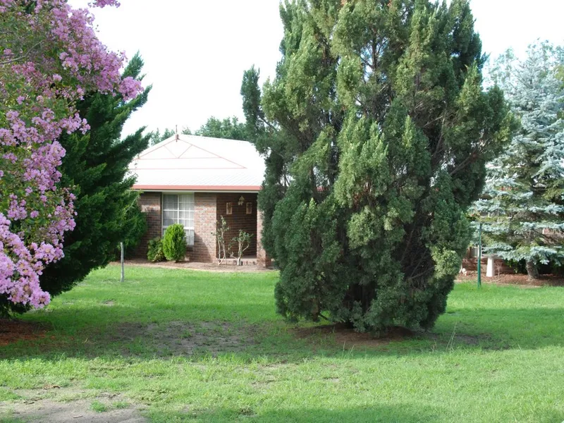 LIVE IN TOWN WITH ACREAGE LIVING!!  4 BEDROOMS 2 BTHROOMS  