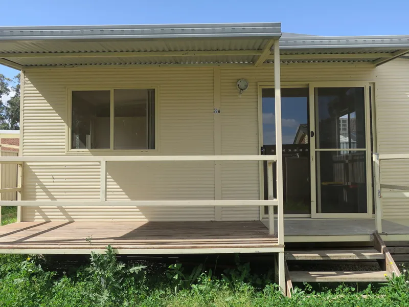 FLAT WITH FRONT PORCH & AIR CON!