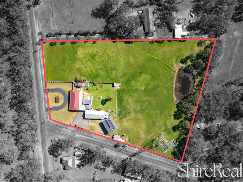 Idyllic 5 acre oasis with dual living