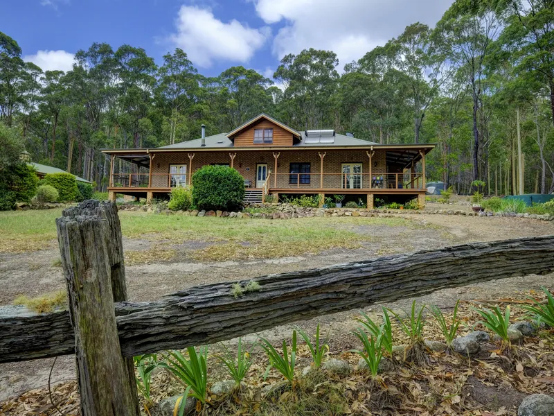 Pristine Colonial sand stock brick veneer and metal residence.