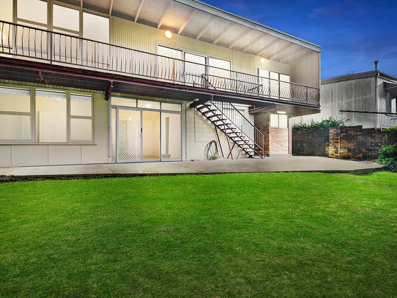 Renovator with bush and water views