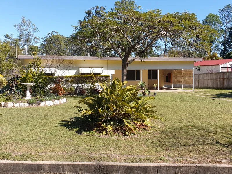 GOOD SOLID ESTABLISHED HOME ON 1/2 ACRE BLOCK IN TOWN