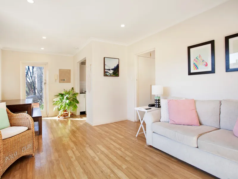 Fresh & bright top floor living with balcony and garage