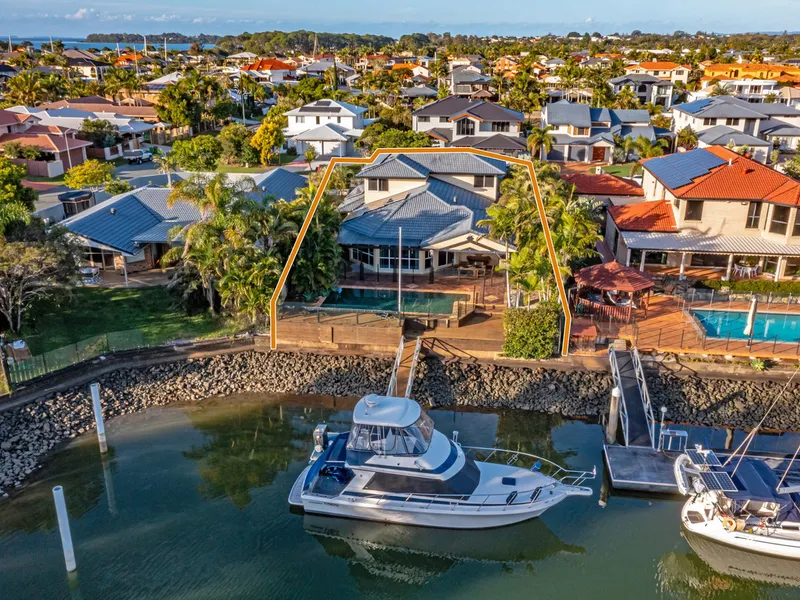 Executive canal front home with large pontoon in prestigious Aquatic Paradise