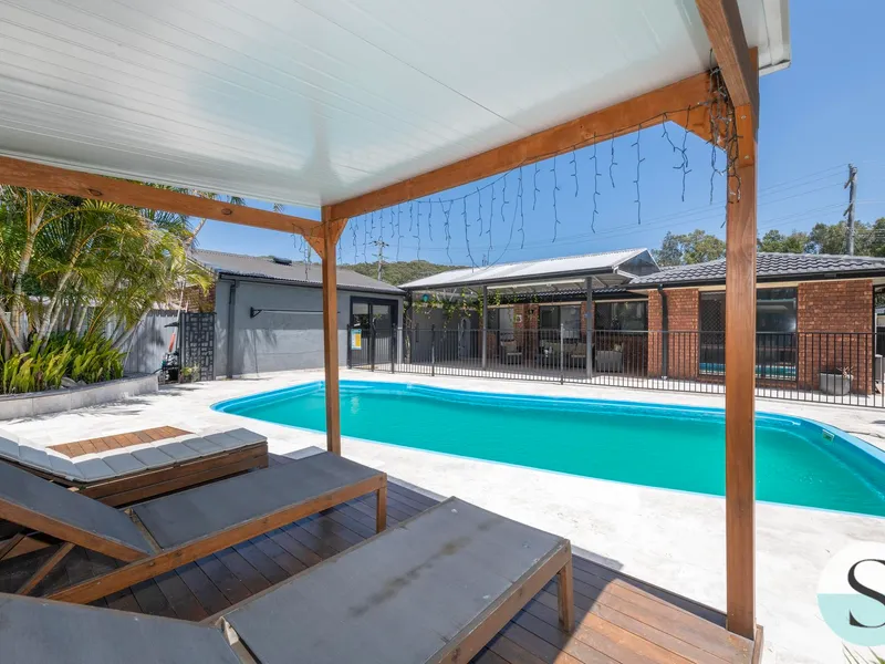 Caves Beach Side of Town, Quiet Cul-De-Sac, Renovated Inside, Idyllic Resort Feel Backyard & No Back Neighbour! Great Garaging & Detached Studio