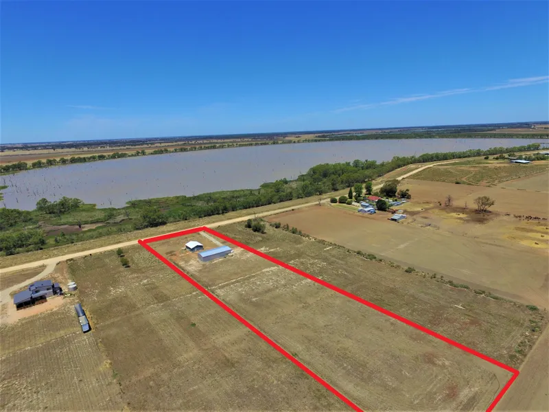 NEAR NEW LAKESIDE HOME SET ON OVER 2 ACRES