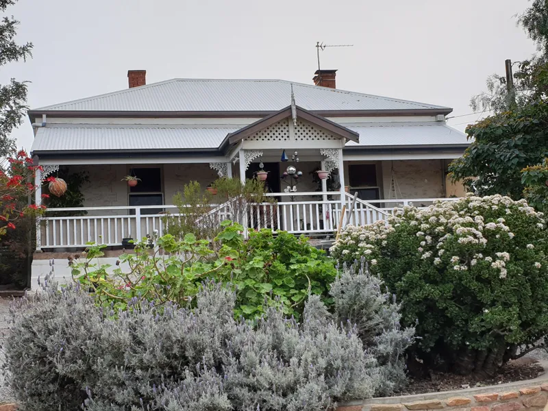 Sensational Stone Home with White Picket Fence!