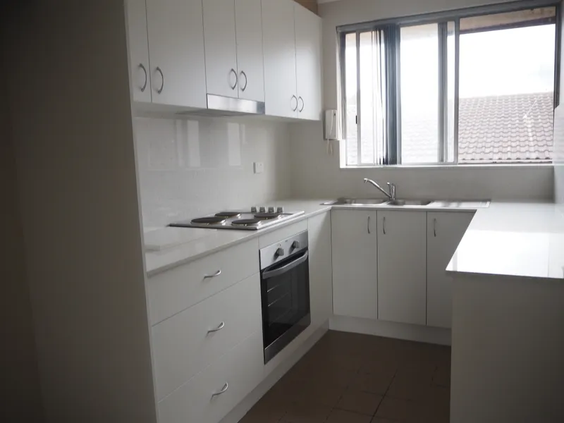 Freshly painted 2 bedroom unit with brand new kitchen