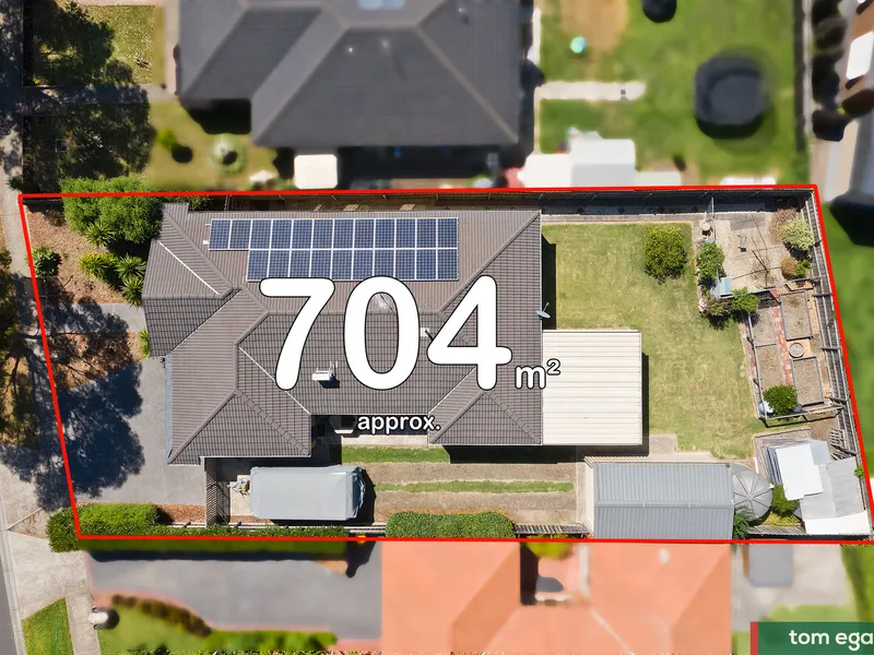 A lovely family home featuring an extra driveway with easy access for all your vehicles.