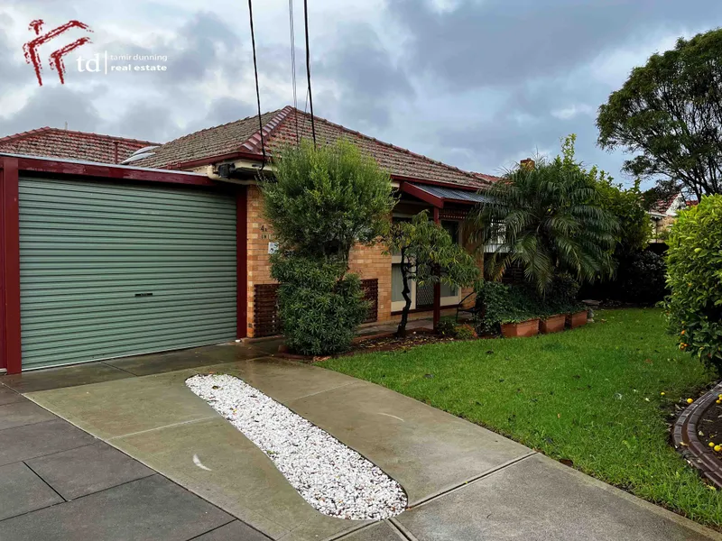 Updated unit with roller door carport.