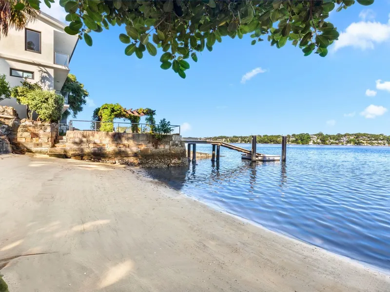 Luxury waterfront with private beach and dual level boat house, 37m of waterfrontage