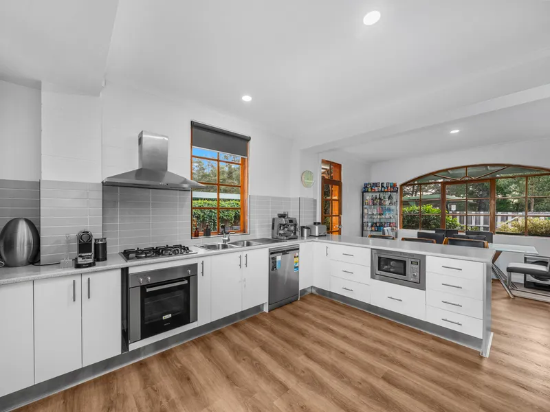 Discover coastal charm in this beautifully renovated, two-story cottage-style home