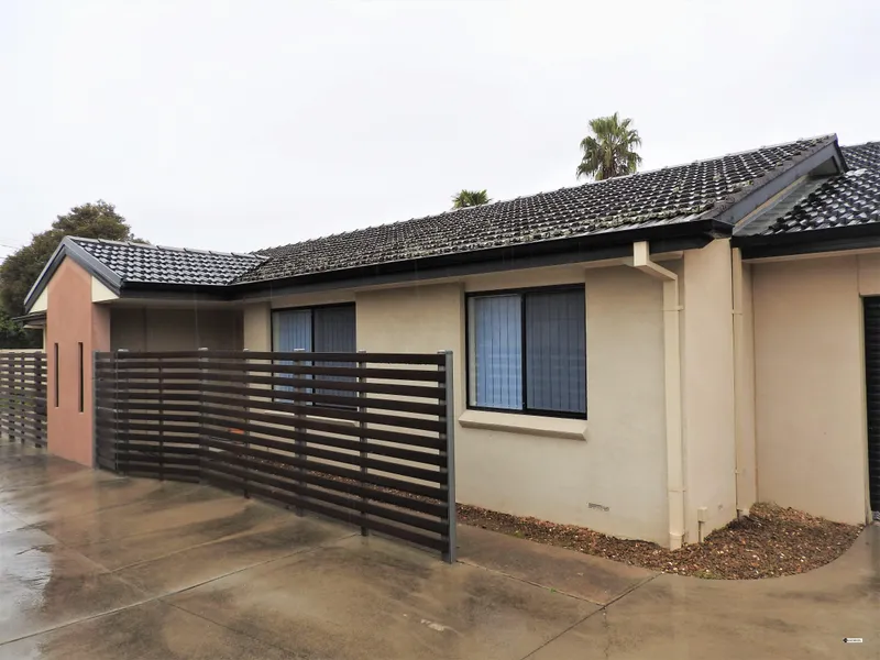 2 BEDROOM UNIT WITH 4 CAR GARAGE!