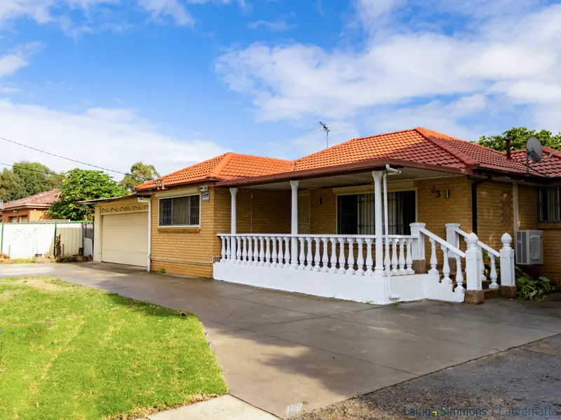 BRICK HOME WITH 4-CAR LOCK-UP GARAGE