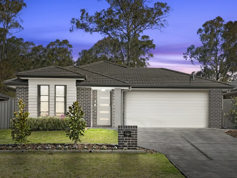 As new brick family home in tranquil village locale