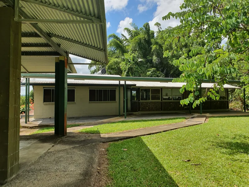 TWO BEDROOM UNUSUALLY BUILT HOME  WITH THREE BAY LARGE SHED, CARPORTS  AND CREEK
