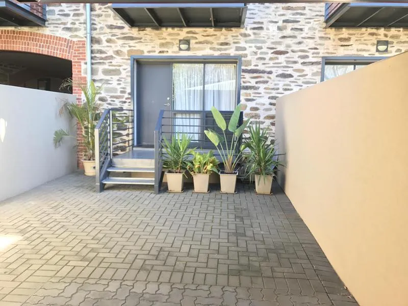 Light Bright and Freshly Painted 3 Bedroom, 2 bathroom (w/ 3rd WC) 3 car spaces with pool and gym access.