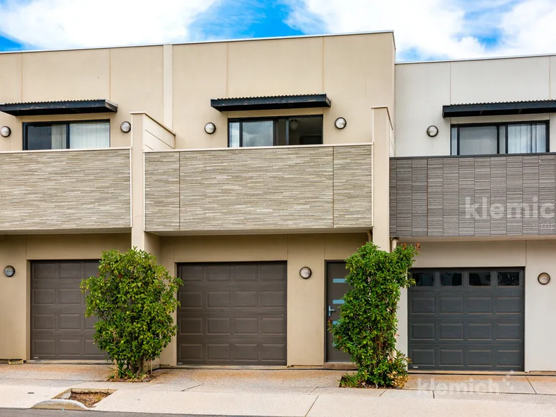 Low maintenance, three bedroom townhouse a stones throw to the shops.