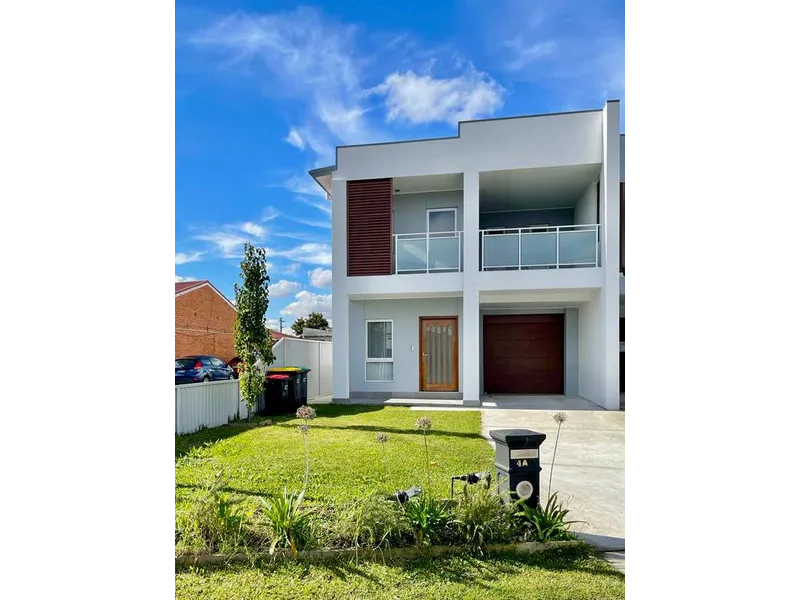 1 Year Young Duplex in a Fantastic Family Neighborhood