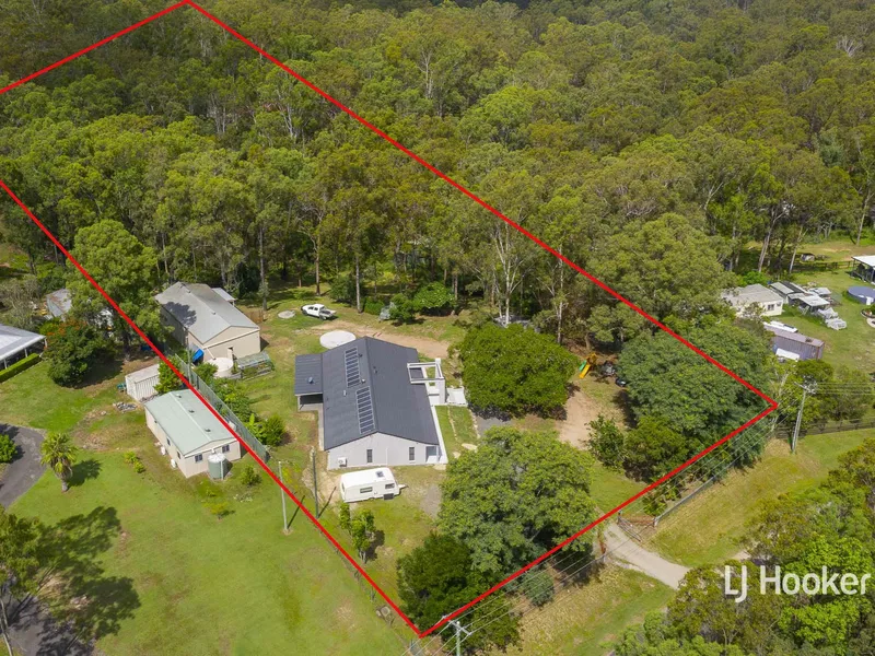 Renovated Large Family Home on Acreage With Worksheds & Privacy!