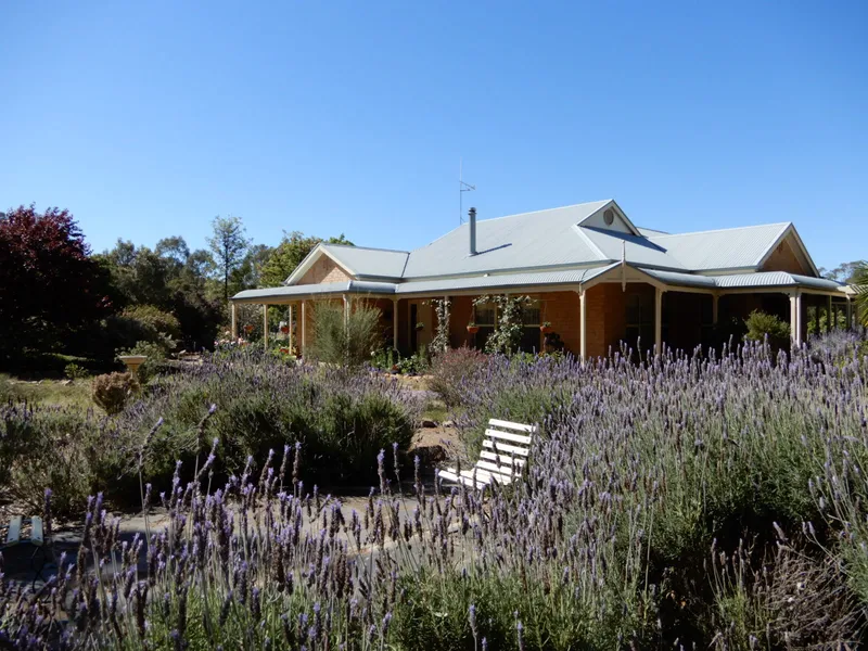 ABSOLUTE STUNNING HOME WITHIN A  BEAUTIFUL SETTING