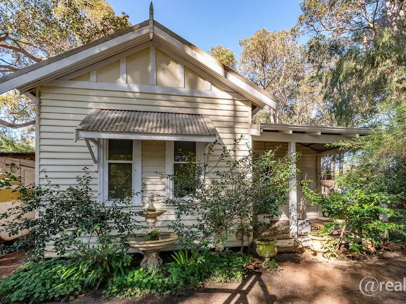 An Idyllic Cottage Nestled Within Serene Surroundings