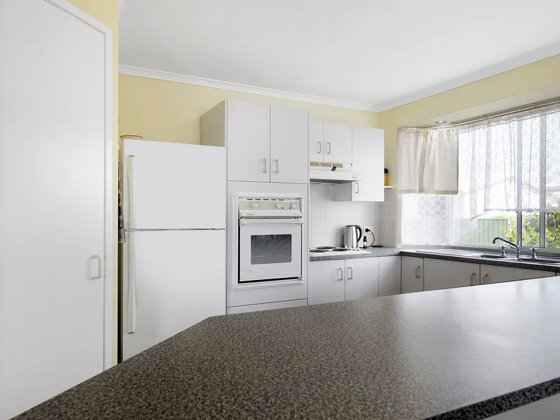 Huge Price Reduction - Owners Keen to Sell ! A North Facing Home within an Over 50's Village at Coombabah - Nice and Light and Airy.
