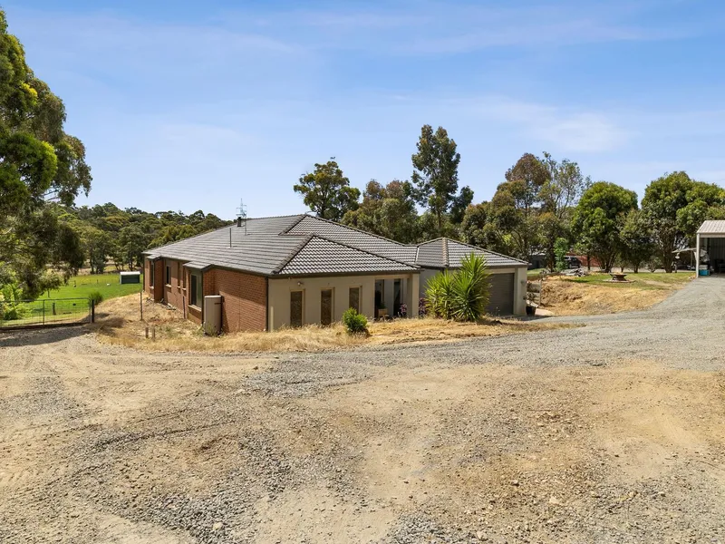 FOUR BEDROOM HOME IN HIGHLY SOUGHT AFTER AREA WITH SHEDDING!