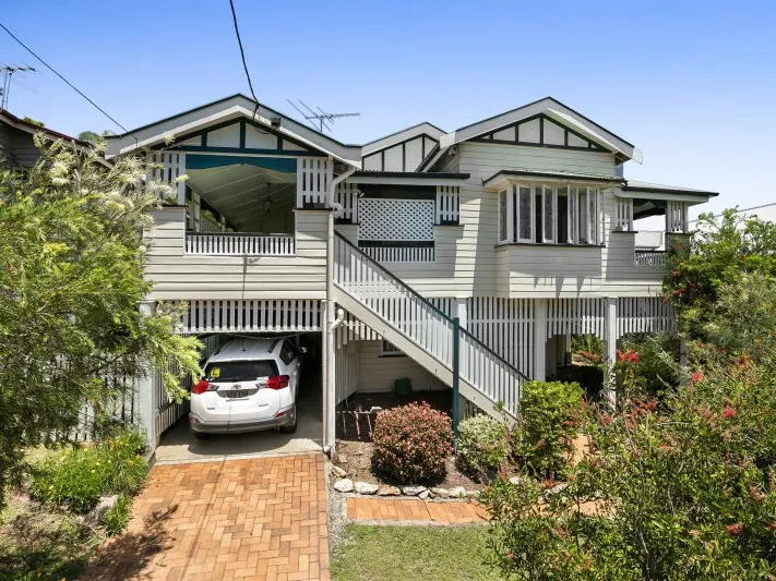 This gracious Queenslander represents charm, privacy and location.
