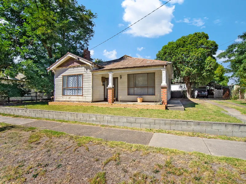 CHARACTER FILLED HOME ON A SPACIOUS ALLOTMENT