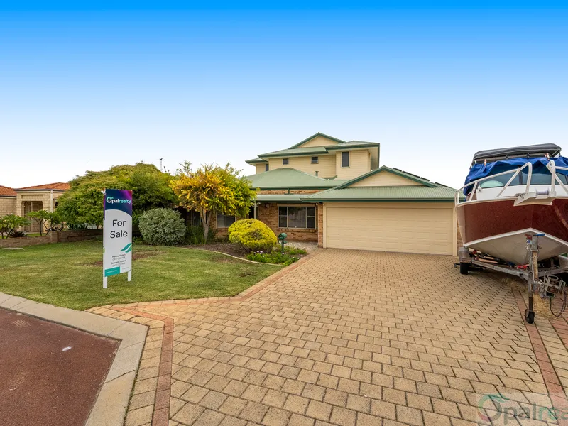 Huge beachside family home with side access