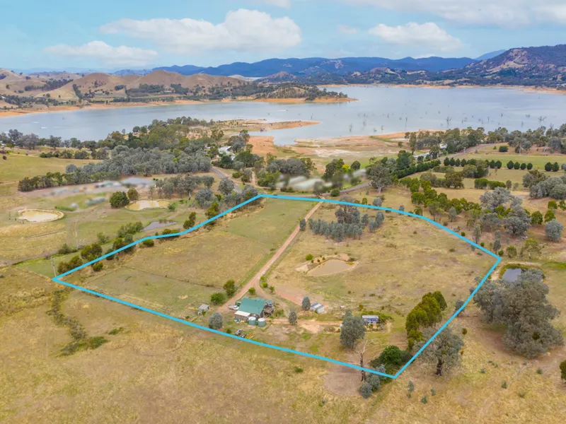 10 ACRES WITH LAKE VIEWS...AND A GREAT VIBE!