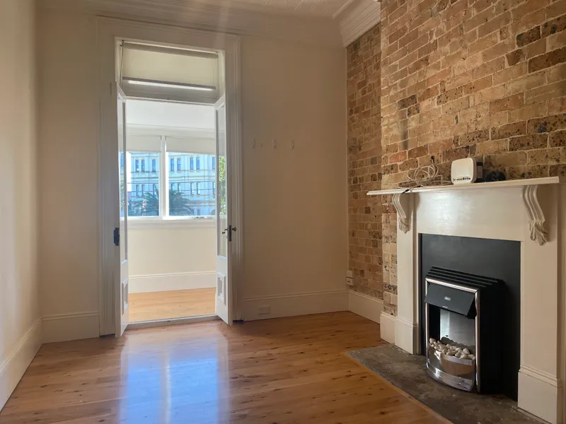 Light filled & renovated 2-bedroom apartment with sunroom & balcony