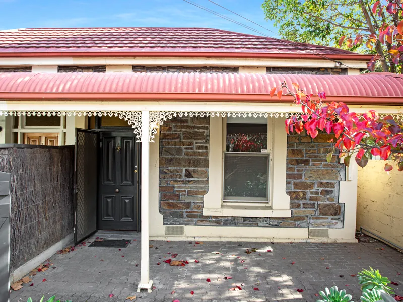 Stone Fronted Cottage with Loads of Character Located in the Heart of Norwood!