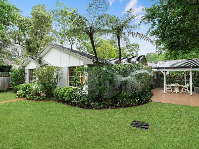 Charming home embraced by established gardens