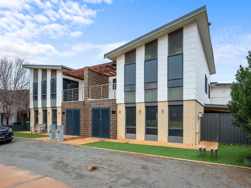 RESORT-STYLE EXECUTIVE DOUBLE STORY TOWN HOUSE WITH JUST A STROLL TO THE GOLF COURSE