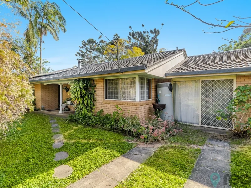 Sweet little brick home with future development potential