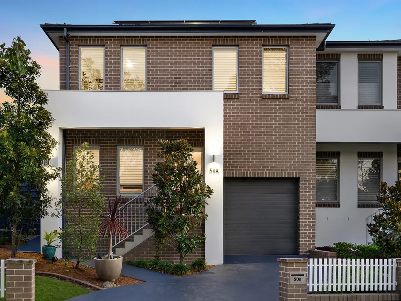 Contemporary sun-filled duplex commands coveted peaceful address