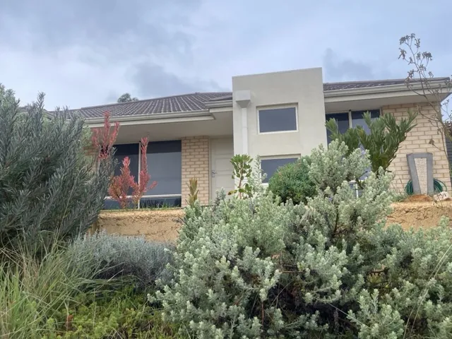ELEVATED HOUSE WITH VIEWS OF THE TOWN