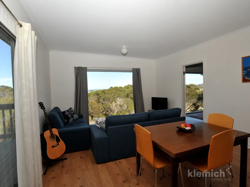Immaculately presented two bedroom home with elevated views across The River to Pelican Lagoon. 