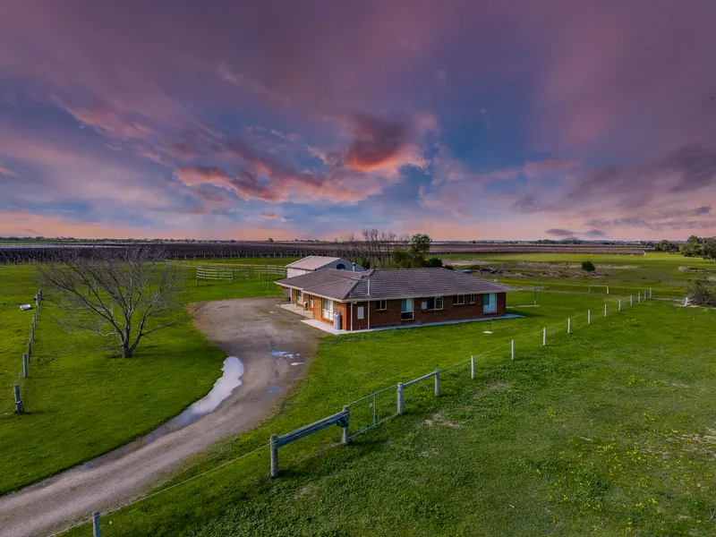 Country comfort with views, vines & 24 level acres to play with…