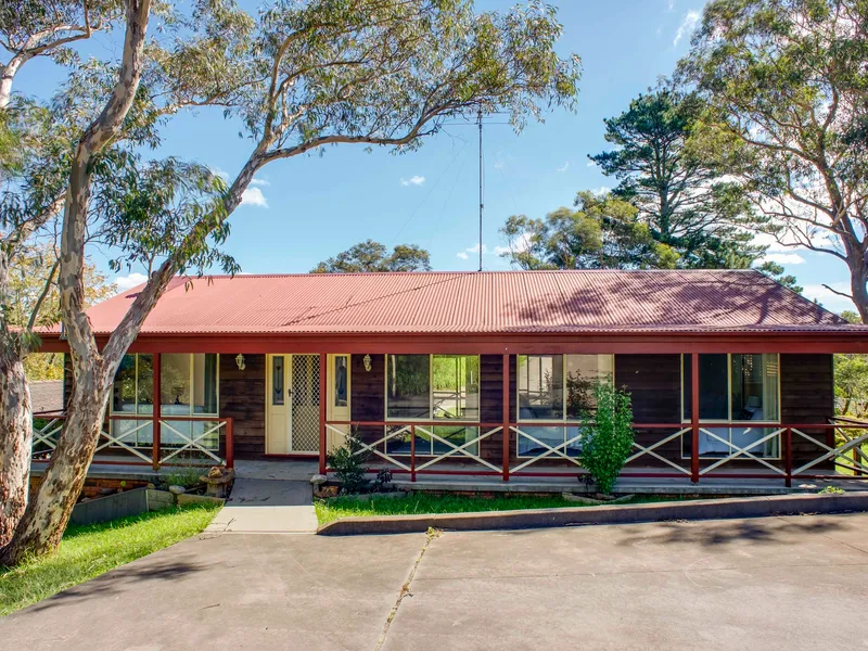 CHARMING HOME WITH AN ELEVATED LEAFY OUTLOOK