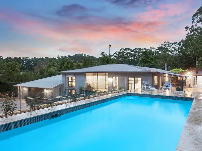 Exquisitely designed residence set on 2.1 park-like acres, 10 mins to beaches