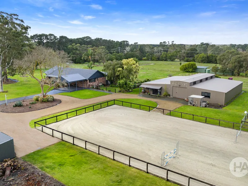 Stunning home on 5 acres with stables & arena